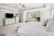 Light and bright main bedroom suite features an expansive layout and neutral color palette at 5662 Valley Loop, Fairburn, GA 30213