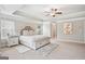 Main bedroom with soft natural light, neutral decor, and an ensuite bathroom entrance at 5662 Valley Loop, Fairburn, GA 30213
