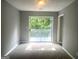 Bright bedroom featuring a large sliding glass door leading to a private outdoor deck at 6650 Smoke Ridge, Atlanta, GA 30349