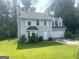 Charming two-story home with a well-maintained lawn and attached two-car garage at 6650 Smoke Ridge, Atlanta, GA 30349