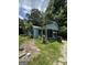 Charming single-story home featuring a quaint front porch, light blue siding, and an unkempt front yard at 8373 Chicago Ave, Douglasville, GA 30134