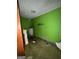 Dated laundry room featuring drab walls, dated flooring, and old laundry fixtures at 8373 Chicago Ave, Douglasville, GA 30134