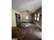 Empty living room with original hardwood floors, ceiling fan, and natural light, needs some renovation at 8373 Chicago Ave, Douglasville, GA 30134