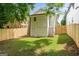 A fenced backyard featuring a patch of grass and stairs leading to the second level at 995 Lena Nw St, Atlanta, GA 30314