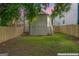 A fenced backyard featuring a patch of grass and stairs leading to the second level at 995 Lena Nw St, Atlanta, GA 30314