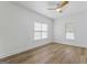 Bright bedroom featuring two windows, wood-look flooring, and a modern ceiling fan at 995 Lena Nw St, Atlanta, GA 30314