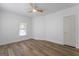 Bedroom featuring wood-look flooring, a modern ceiling fan, and a white door at 995 Lena Nw St, Atlanta, GA 30314