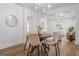 Bright dining area features wood floors, a modern light fixture, and seamless transition into the inviting living room at 995 Lena Nw St, Atlanta, GA 30314
