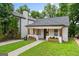 Charming home with a well-manicured lawn, inviting front porch, and a classic exterior at 995 Lena Nw St, Atlanta, GA 30314
