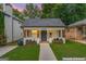 Charming home with a well-manicured lawn, inviting front porch, and a classic exterior, virtually enhanced for appeal at 995 Lena Nw St, Atlanta, GA 30314