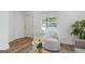 Bright living room with hardwood floors, natural light, and a cozy seating area with a modern chair at 995 Lena Nw St, Atlanta, GA 30314