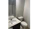 Bathroom featuring a sleek vanity with a marble countertop, toilet, and tile flooring at 3810 Equity, Powder Springs, GA 30127