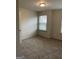 This bedroom features neutral walls, plush carpet, and a window with blinds for natural light at 3810 Equity, Powder Springs, GA 30127