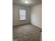 This bedroom features neutral walls, plush carpet, and a window with blinds for natural light at 3810 Equity, Powder Springs, GA 30127