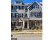 Stylish townhome featuring a welcoming front entrance with stone and siding accents and well-maintained landscaping at 3810 Equity, Powder Springs, GA 30127
