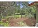 Fenced backyard with a well-maintained lawn and stone pathway, offering privacy and outdoor space at 6220 Petersburg Rd, Fairburn, GA 30213