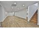 Spacious finished basement featuring wood-look floors and recessed lighting at 6220 Petersburg Rd, Fairburn, GA 30213