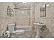 Traditional bathroom featuring tile surround, vanity sink, and toilet at 6220 Petersburg Rd, Fairburn, GA 30213