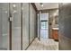 Contemporary bathroom showcases tiled walls, glass shower, and natural light at 6220 Petersburg Rd, Fairburn, GA 30213
