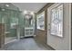 Modern bathroom features mosaic tiles, a sleek vanity, and a glass-enclosed shower at 6220 Petersburg Rd, Fairburn, GA 30213