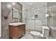 Sleek bathroom boasts wood vanity, glass shower, and stylish tile surround at 6220 Petersburg Rd, Fairburn, GA 30213