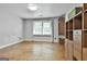 Bedroom features wood floors, natural light, and built-in storage and desk at 6220 Petersburg Rd, Fairburn, GA 30213
