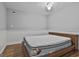 This bedroom offers gray walls, white trim, wood floors, and a comfortable-looking bed at 6220 Petersburg Rd, Fairburn, GA 30213