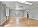 Bright bonus room with multiple skylights and hardwood floors, creating a versatile space at 6220 Petersburg Rd, Fairburn, GA 30213