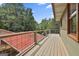 Outdoor deck with wooden floors features a red roof under construction at 6220 Petersburg Rd, Fairburn, GA 30213