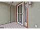 Close-up of the front door with decorative glass and a neutral trim, creating a welcoming entry at 6220 Petersburg Rd, Fairburn, GA 30213
