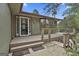 Cozy front porch with a charming entrance, wooden deck, and a well-maintained exterior at 6220 Petersburg Rd, Fairburn, GA 30213