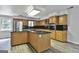 A kitchen features wood cabinets, granite countertops, and stainless steel appliances at 6220 Petersburg Rd, Fairburn, GA 30213
