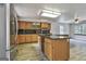 A kitchen features wood cabinets, granite countertops, and stainless steel appliances at 6220 Petersburg Rd, Fairburn, GA 30213