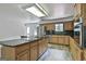 A kitchen shows wood cabinets, granite countertops, and stainless steel appliances at 6220 Petersburg Rd, Fairburn, GA 30213