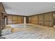 Spacious living room with a fireplace and wood paneling at 6220 Petersburg Rd, Fairburn, GA 30213
