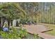 Landscaped backyard patio with seating area and fountain, perfect for outdoor relaxation and entertaining at 375 Darren Dr, Fayetteville, GA 30215