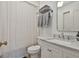 Bright bathroom with marble vanity, white cabinets, stylish chrome fixtures, and a shower-tub combo at 375 Darren Dr, Fayetteville, GA 30215