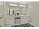 Bathroom vanity with large mirror, ample storage and bright lighting at 375 Darren Dr, Fayetteville, GA 30215