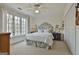 Bedroom with large windows, neutral carpet, and white trim at 375 Darren Dr, Fayetteville, GA 30215