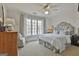 Bright bedroom with a large window, neutral carpet, and stylish decor at 375 Darren Dr, Fayetteville, GA 30215