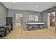 Finished basement game room features a pool table, an arcade game, and ample space at 375 Darren Dr, Fayetteville, GA 30215