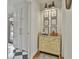 Hallway boasts unique display cabinet and neutral decor with black and white tile at 375 Darren Dr, Fayetteville, GA 30215