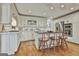 Beautiful kitchen with an island, barstool seating, custom cabinets, and stainless steel appliances at 375 Darren Dr, Fayetteville, GA 30215