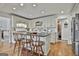 Well-appointed kitchen featuring an island with barstools, custom cabinetry, and stainless steel appliances at 375 Darren Dr, Fayetteville, GA 30215