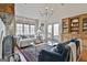 Bright living room boasts vaulted ceilings, large windows, a cozy fireplace, and hardwood flooring at 375 Darren Dr, Fayetteville, GA 30215