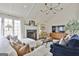 Stylish living room with fireplace, vaulted ceiling, plush seating, and large windows with natural light at 375 Darren Dr, Fayetteville, GA 30215