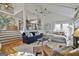 Cozy living room with fireplace, vaulted ceilings, and comfortable seating offering a relaxing space at 375 Darren Dr, Fayetteville, GA 30215