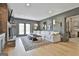 Comfortable living room with a fireplace, modern lighting, and a walkout to the yard at 375 Darren Dr, Fayetteville, GA 30215