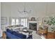 Bright living room featuring a fireplace, vaulted ceilings, and a comfortable seating arrangement at 375 Darren Dr, Fayetteville, GA 30215