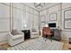 Bright home office features built in trim, stylish furnishings, and natural light at 375 Darren Dr, Fayetteville, GA 30215